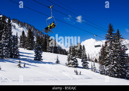 A chair lift carries skiers at Alta, one of the only resorts in America for skiers only, Alta Ski Resort, Salt Lake City, Utah Stock Photo