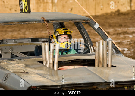 Female driver in a demolition derby Stock Photo