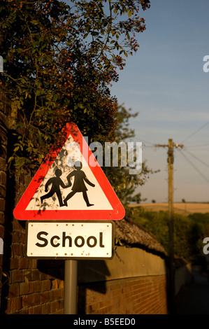 Triangular road sign for safe crossing of school children Stock Photo