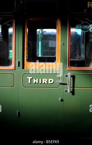 The Bluebell Railway in East Sussex. A carriage door of a third class travel compartment on the preserved steam railway. Stock Photo