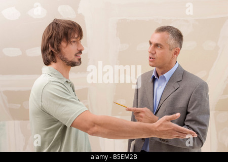 Two men talking and gesturing, portrait Stock Photo