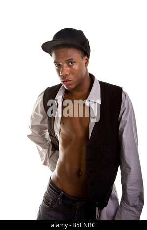 A good looking young black man in grey and black with shirt open showing flat abdominal muscles Stock Photo