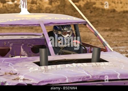 Female driver in a demolition derby Stock Photo