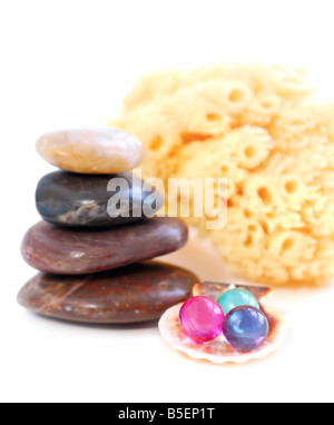 Stack of balanced stones with bath beads isolated on white background Stock Photo