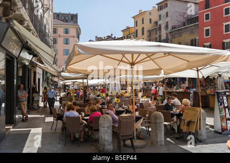 Street cafe with market stalls behind, Piazza delle Erbe, Verona, Veneto, Italy Stock Photo