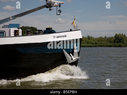 Bow wave of a commercial barge in Holland Stock Photo