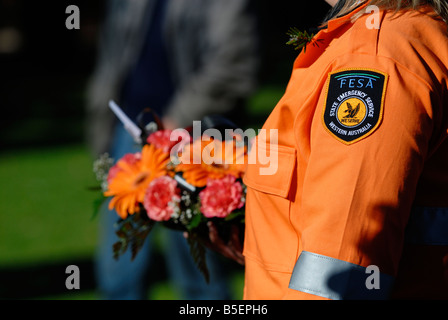 State Emergency Services (SES) officer presenting a wreath on Anzac Day. Guildford, Perth, Western Australia Stock Photo