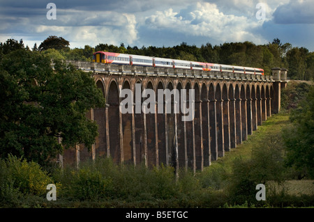 A South West Trains commuter express train crosses the Ouse Valley Viaduct at Balcombe near Haywards Heath, Sussex Stock Photo