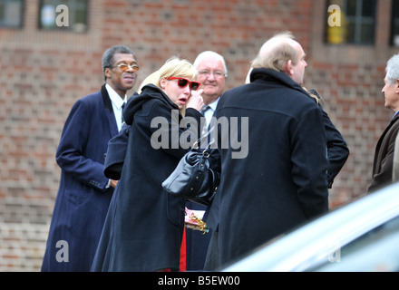 A mourner arriving for Jeremy Beadle s funeral today in Finchley Stock Photo