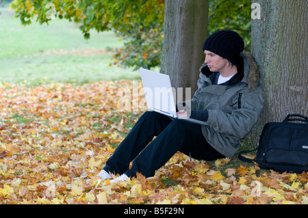 young male student using laptop computer Stock Photo