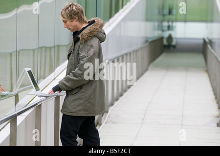 young male using laptop computer Stock Photo