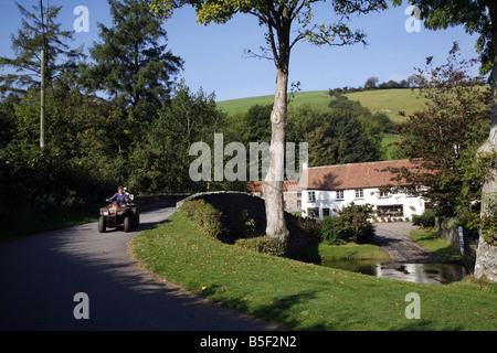 The pretty Exmoor hamlet of  Malmsmead on Badgworthy Water in the Doone Valley near Oare Stock Photo