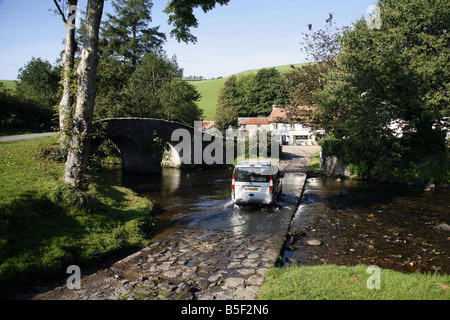 The pretty Exmoor hamlet of  Malmsmead on Badgworthy Water in the Doone Valley near Oare Stock Photo