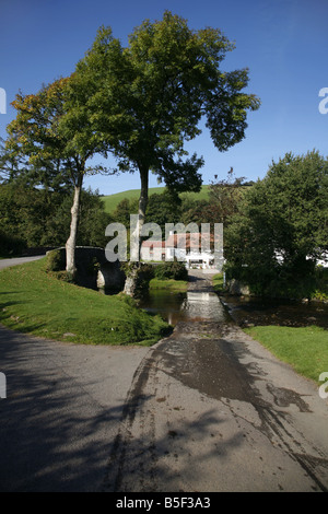 The pretty Exmoor hamlet of  Malmsmead on Badgworthy Water in the Doone Valley near Oare Stock Photo