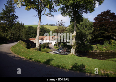 The pretty Exmoor hamlet of  Malmsmead on Badgworthy Water in the Doone Valley near Oare Stock Photo