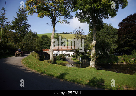 The pretty Exmoor hamlet of  Malmsmead on Badgworthy Water in the Doone Valley near Oare Stock Photo