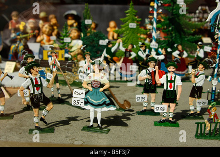 tin toys with bavarian national dress in a shop window in Fuessen Allgaeu Bavaria Germany Stock Photo