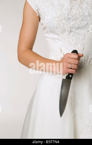 Bride holding knife, close-up Stock Photo