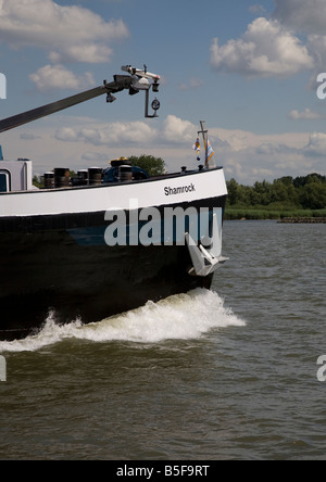 Bow wave of a commercial barge in Holland Stock Photo