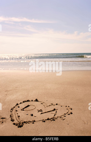 Germany, Baltic sea, Heart drawn in sand on beach Stock Photo