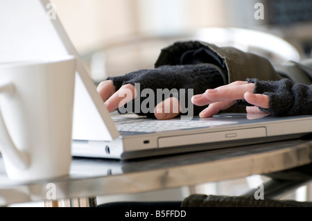young male hands on laptop computer keyboard Stock Photo