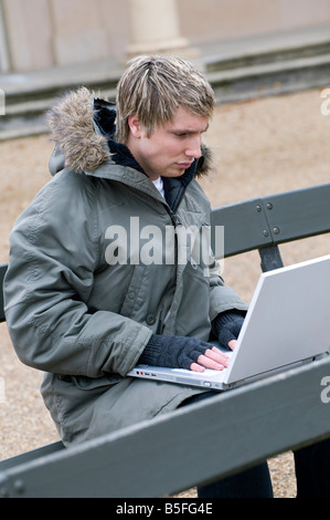 young male using laptop computer Stock Photo
