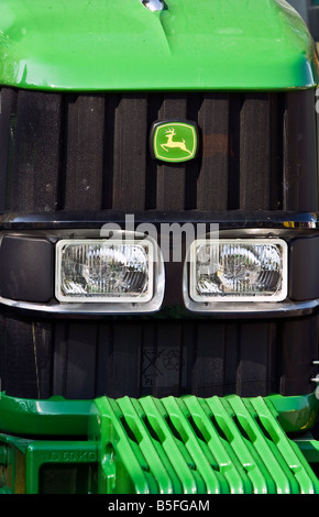 John Deere logo on front of a John Deere tractor Stock Photo