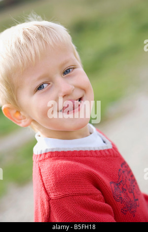 Little boy (3-4) poking his tongue out, portrait Stock Photo