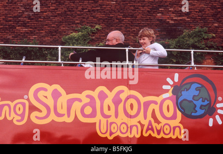 Smiling young boy and adult on top of Stratford doubledecker tour bus, Stratford Upon Avon, Warwickshire, England Stock Photo