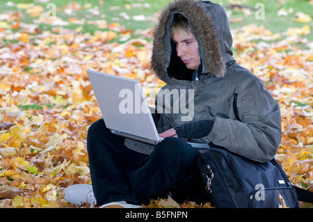 young male using laptop computer Stock Photo