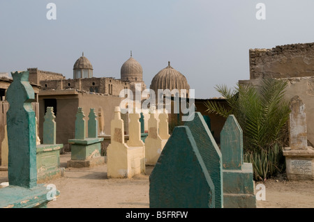Dense grid of tomb and Islamic mausoleum structures in the City of the Dead or Cairo Necropolis where some people live and work amongst the dead in so Stock Photo