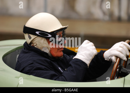 Sir Stirling moss driving at Silverstone Stock Photo