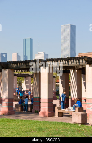 Houston's East End Hispanic neighborhood, Guadalupe Plaza, children on play scape with downtown skyline Stock Photo