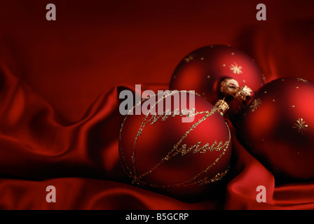 Christmas decoration on a red silky background Stock Photo