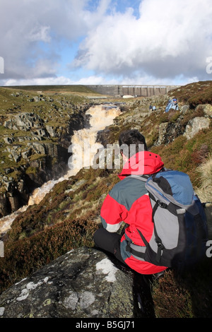 Walker Resting and Enjoying the View of Cauldron Snout Waterfall Upper Teesdale County Durham Stock Photo
