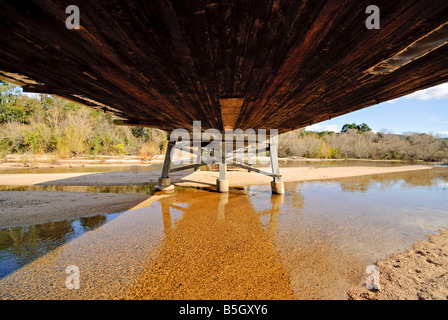 Under a bridge on a low river in a drought in Towamba New South Wales Australia Stock Photo