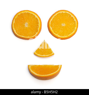Face made of orange pieces Stock Photo