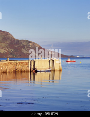 Lamlash Pier and the Holy Island off Isle of Arran, North Ayrshire, Scotland, UK. Stock Photo