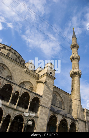 The Blue Mosque set against a blue sky, showing the domed ceiling and minaret tower, in Istanbul, Turkey. Stock Photo