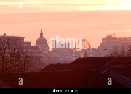 A salmon pink sunset over the skyline of Nottingham City Centre, Nottinghamshire England UK Stock Photo