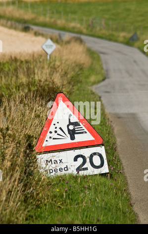 dh Roadsign ROAD UK Lose chippings warning sign 20 mph max speed traffic caution transport roadside signage Stock Photo
