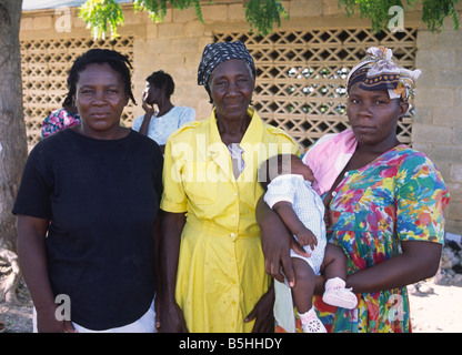 Three generations of women in the same family attend their local women’s group on La Gonave island in Haiti Stock Photo
