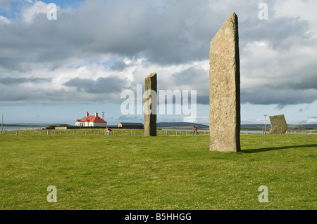 dh Standing stones of Stenness STENNESS ORKNEY Cyclist riding passed ancient neolithic standing stone circle Stock Photo