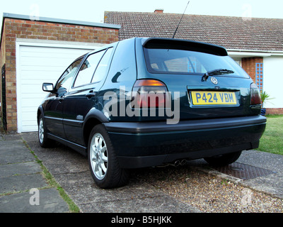 The Mk3 GTi, built to last, pocket rocket, solid motoring, enthusiasts, boy racer, two-bar grille, black wheel arches, bumper extension, hot hatch. Stock Photo