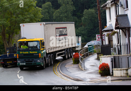 Heavy lorry crossing the river bridge in rural market town of Usk Monmouthshire South Wales UK Stock Photo