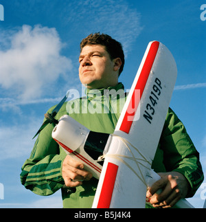 Man with a remote controlled model aircraft in Wormwood Scrubs, London Stock Photo