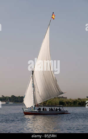 Traditional wooden Felucca sailing boat on the Nile river in Aswan Egypt Stock Photo