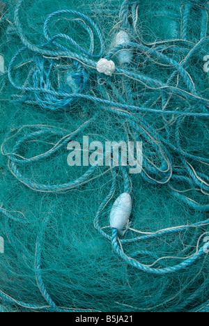 fishing nets harbour quay wall side multicolour Stock Photo