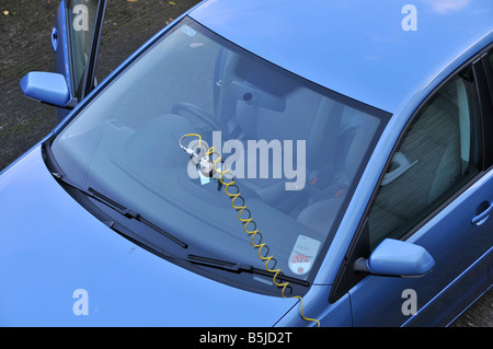 View from above looking down at VW Volkswagen Polo car and mobile windscreen crack damage repair equipment kit on glass screen England UK Stock Photo
