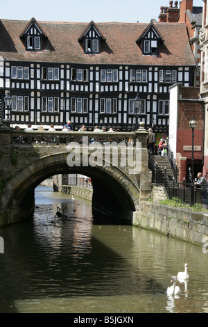 City of Lincoln, England. View of Lincoln’s medieval High Bridge over the River Witham with High Street shops on the bridge. Stock Photo